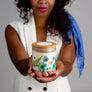 Hand poured soy candle with blue pressed flowers